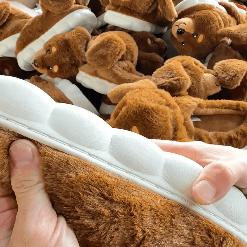 Manual outsole attachment inspection on bulk plush indoor slippers