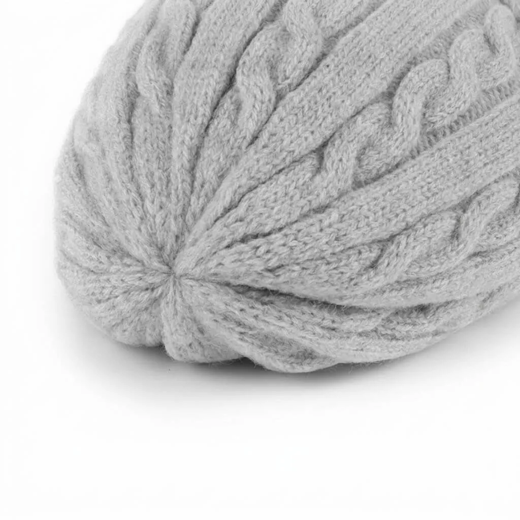 Grey Cable Knit Beanie Top Detail Close up view of the premium cable knit texture on the top of the grey winter beanie.