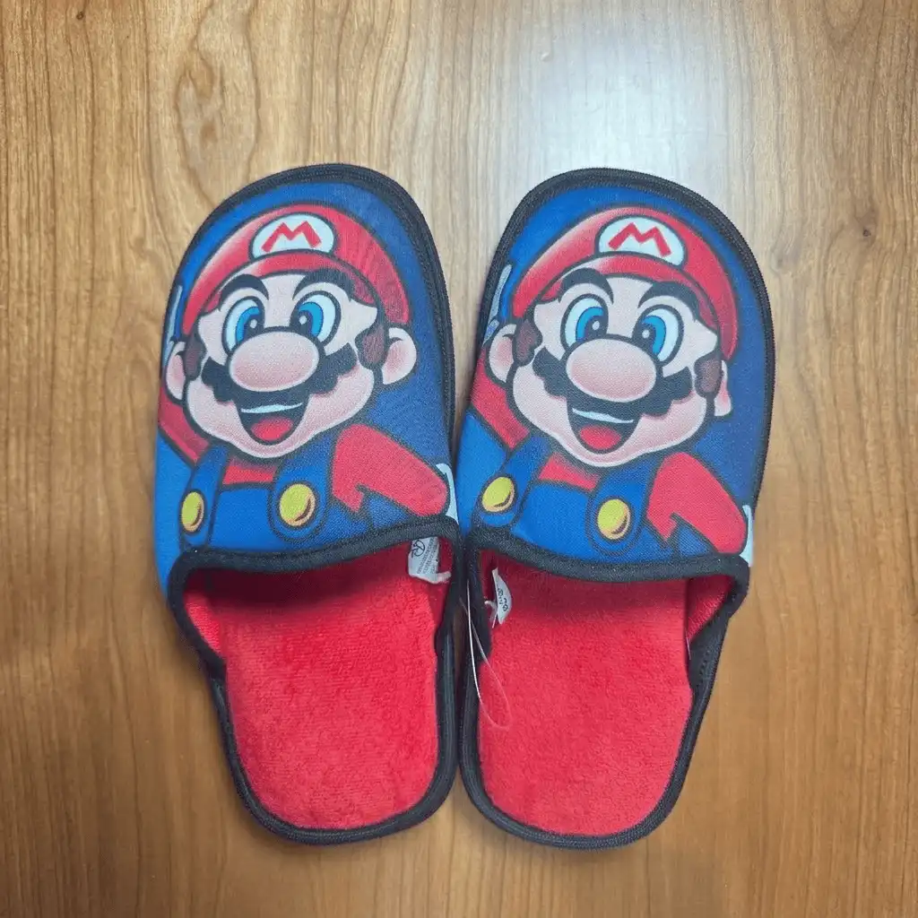 Custom slippers bulk production featuring a precision heat transfer print of a complex multi-color graphic with exact Pantone matching.