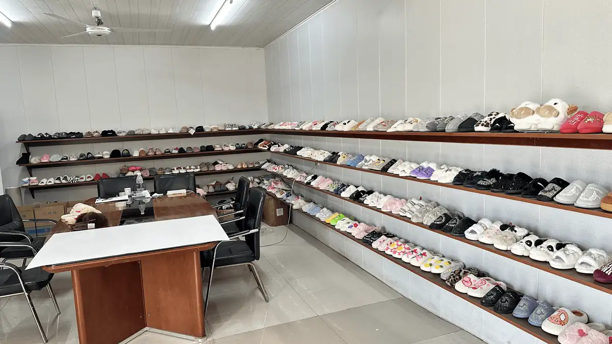 Indoor slipper samples displayed in Utop’s sample room for buyer project reviews
